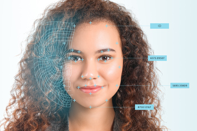 A young woman being scanned by biometric technology.