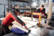 Two men working with wood.