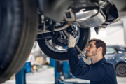 A mechanic repairing a car.