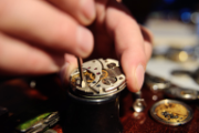 A worker assembles a watch.