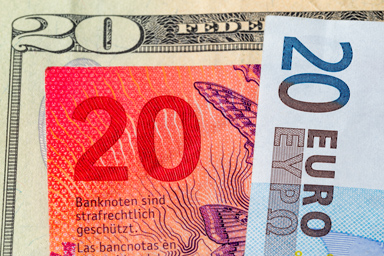 Bills of twenty francs, euros and dollars.