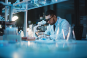 A researcher at his microscope.