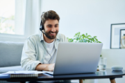 A man videoconferencing at home.