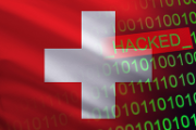 The Swiss flag with a binary system and the term HACKED in green