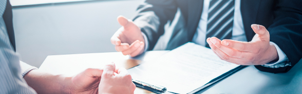 Two men chatting during a business meeting