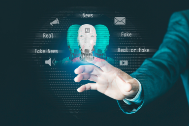 Una persona clicca sulla testa di un robot circondata da pittogrammi e dai termini Real, Fake
